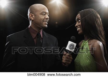 Broadcaster interviewing celebrity View Large Photo Image Stock Photo - Broadcaster interviewing celebrity. Fotosearch