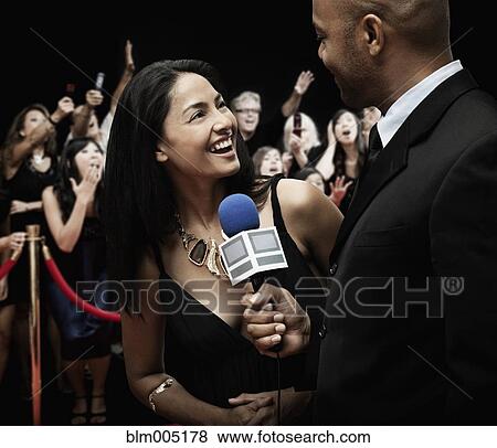 Stock Photo - Broadcaster interviewing celebrity. Fotosearch