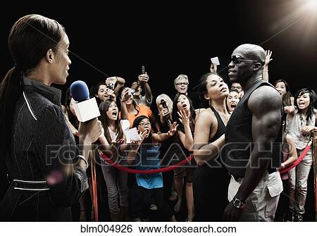 Broadcaster interviewing celebrity View Large Photo Image Stock Photograph - Broadcaster interviewing celebrity. Fotosearch