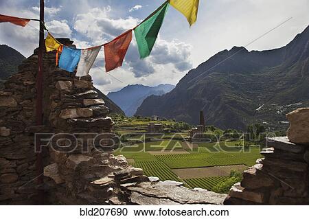 Buddhist prayer flags with mountains and fields in background View Large Photo Image Stock Image - Buddhist prayer flags with mountains and fields in background. Fotosearch