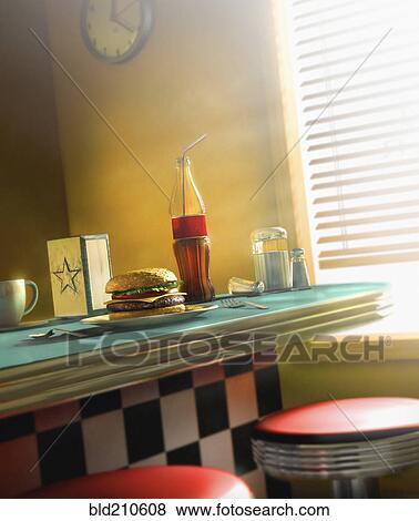 Burger and soda on diner counter View Large Photo Image Stock Photo - Burger and soda on diner counter. Fotosearch