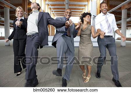 Business people dancing in empty office space View Large Photo Image Stock Image - Business people dancing in empty office space. Fotosearch