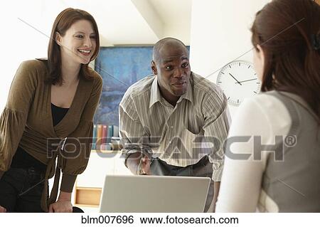 Business people having meeting in office View Large Photo Image Stock Photograph - Business people having meeting in office. Fotosearch