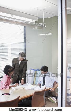 Business people in meeting in conference room View Large Photo Image Stock Image - Business people in meeting in conference room. Fotosearch