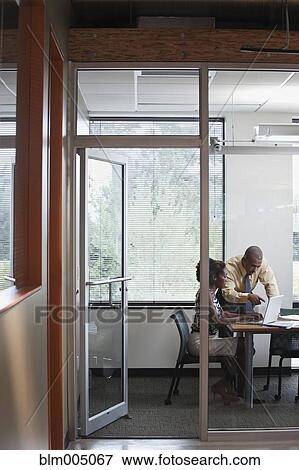 Business people in meeting in conference room View Large Photo Image Stock Photo - Business people in meeting in conference room. Fotosearch