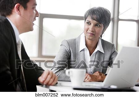 Business people in meeting View Large Photo Image Stock Image - Business people in meeting. Fotosearch
