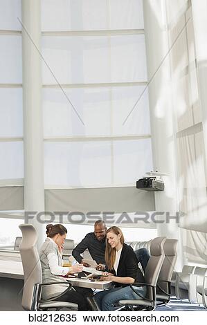 Stock Photography - Business people in meeting. Fotosearch
