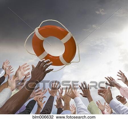 Business people reaching for life preserver View Large Photo Image Stock Image - Business people reaching for life preserver. Fotosearch