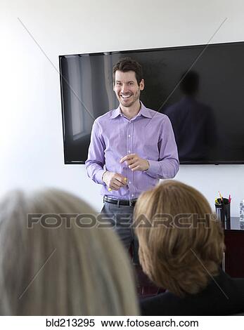 Stock Photography - Businessman talking in meeting. Fotosearch