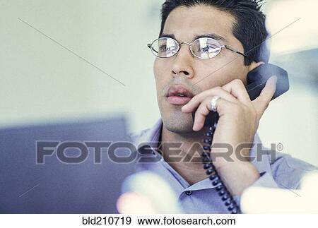 Businessman talking on telephone View Large Photo Image Stock Photo - Businessman talking on telephone. Fotosearch