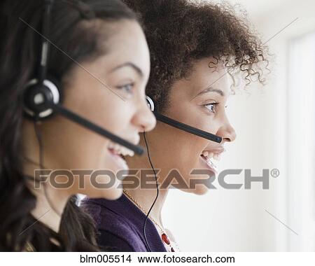 Picture - Businesswomen working in call center. Fotosearch