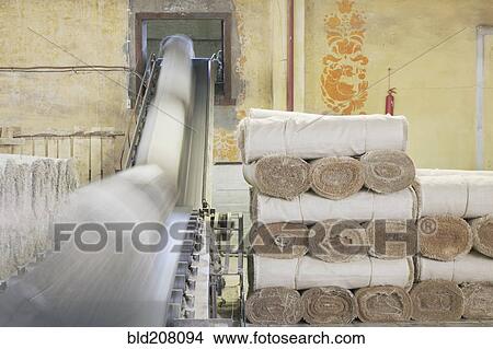 Picture - Canvas Rolls on a Conveyor. Fotosearch