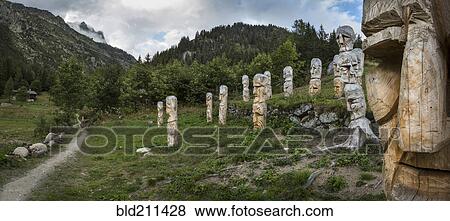 Stock Photo - Carved totem poles on Mt. Blanc trail, Argentiere, France. Fotosearch