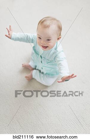Caucasian baby girl with Down Syndrome laughing View Large Photo Image Stock Photograph - Caucasian baby girl with Down Syndrome laughing. Fotosearch