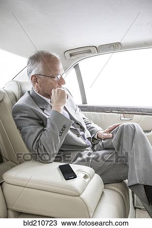 Caucasian businessman sitting in car View Large Photo Image Stock Image - Caucasian businessman sitting in car. Fotosearch