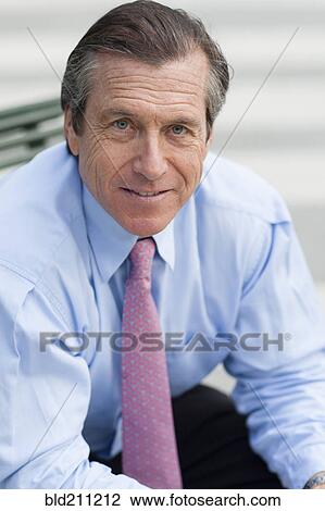 Caucasian businessman smiling outdoors View Large Photo Image Stock Image - Caucasian businessman smiling outdoors. Fotosearch
