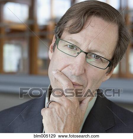 Stock Photo - Caucasian businessman thinking. Fotosearch