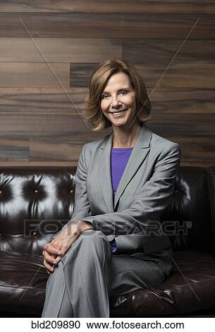 Caucasian businesswoman smiling in office View Large Photo Image Stock Image - Caucasian businesswoman smiling in office. Fotosearch