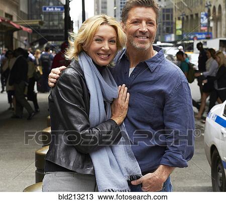 Caucasian couple hugging on city street, New York City, New York, United States View Large Photo Image Stock Image - Caucasian couple hugging on city street, New York City, New York, United States. Fotosearch
