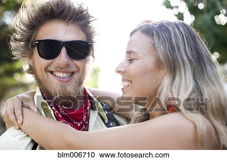 Caucasian couple hugging View Large Photo Image Stock Image - Caucasian couple hugging. Fotosearch
