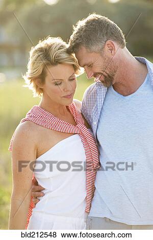 Stock Photo - Caucasian couple hugging. Fotosearch