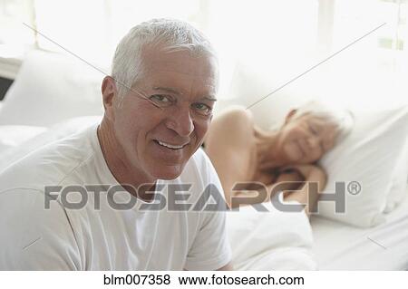 Caucasian couple on bed View Large Photo Image Stock Photo - Caucasian couple on bed. Fotosearch