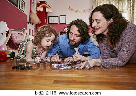 Caucasian family drawing in bedroom View Large Photo Image Stock Photograph - Caucasian family drawing in bedroom. Fotosearch