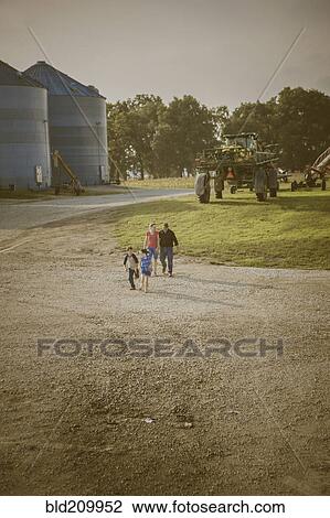 Caucasian family walking on farm View Large Photo Image Stock Image - Caucasian family walking on farm. Fotosearch