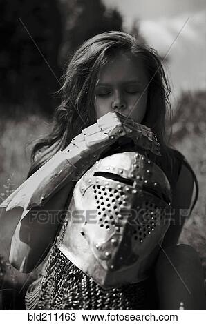 Caucasian girl carrying armor outdoors View Large Photo Image Stock Image - Caucasian girl carrying armor outdoors. Fotosearch