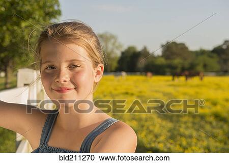 Caucasian girl smiling in rural landscape View Large Photo Image Stock Image - Caucasian girl smiling in rural landscape. Fotosearch
