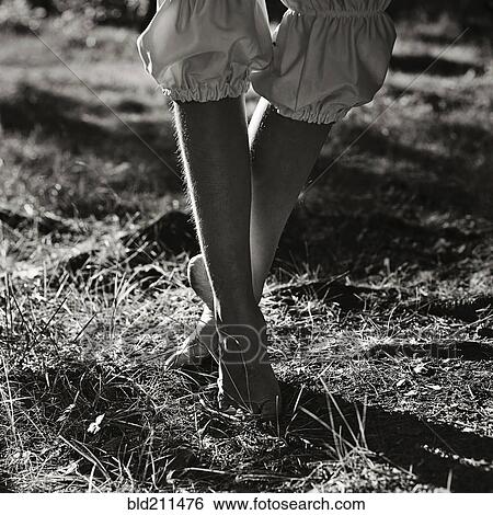 Stock Photograph - Caucasian girl walking outdoors. Fotosearch