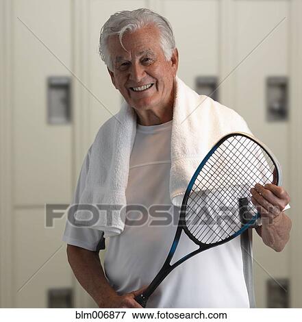 Caucasian man holding squash racquet View Large Photo Image Stock Photo - Caucasian man holding squash racquet. Fotosearch