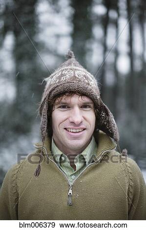 Stock Photo - Caucasian man in cap outdoors. Fotosearch