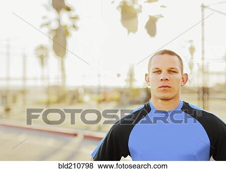 Caucasian man in sportswear outdoors View Large Photo Image Stock Photo - Caucasian man in sportswear outdoors. Fotosearch