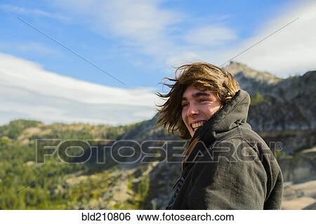Caucasian man smiling in rural landscape View Large Photo Image Stock Photograph - Caucasian man smiling in rural landscape. Fotosearch