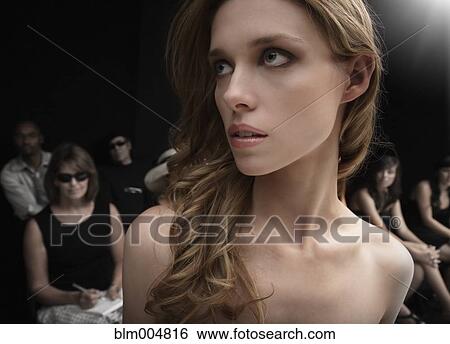 Stock Photograph - Caucasian model on runway at fashion show. Fotosearch
