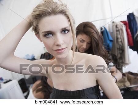 Stock Image - Caucasian model preparing for fashion show. Fotosearch
