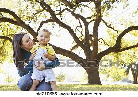 Caucasian mother and son in park View Large Photo Image Stock Photography - Caucasian mother and son in park. Fotosearch