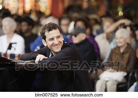 Caucasian musician sitting at piano View Large Photo Image Stock Photography - Caucasian musician sitting at piano. Fotosearch