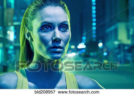 Stock Photo - Caucasian runner standing on city street. Fotosearch
