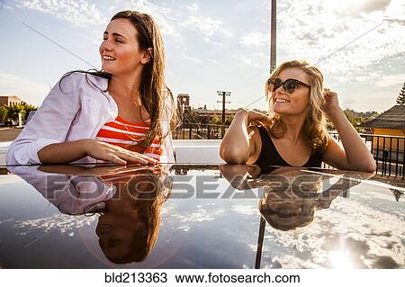 Caucasian teenage girls reflected in car roof View Large Photo Image Stock Image - Caucasian teenage girls reflected in car roof. Fotosearch