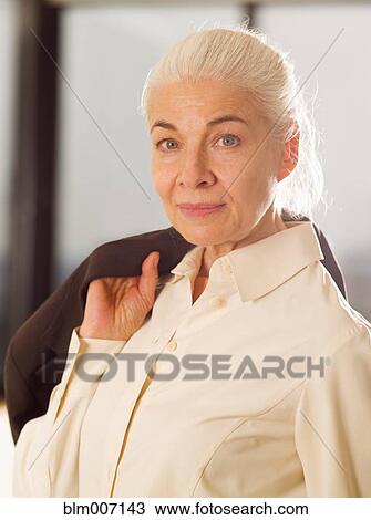 Caucasian woman holding jacket View Large Photo Image Stock Image - Caucasian woman holding jacket. Fotosearch