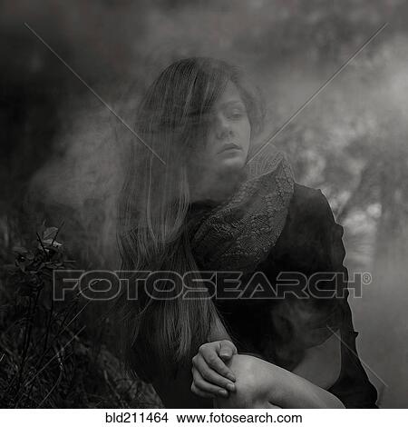 Picture - Caucasian woman in fog outdoors. Fotosearch