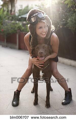 Caucasian woman in fur hat riding dog View Large Photo Image Stock Photo - Caucasian woman in fur hat riding dog. Fotosearch