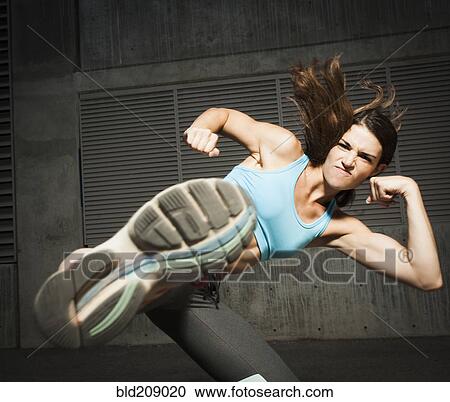 Caucasian woman kicking View Large Photo Image Stock Image - Caucasian woman kicking. Fotosearch