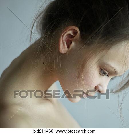Stock Image - Caucasian woman looking down. Fotosearch