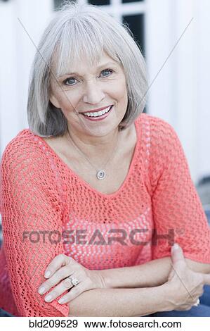 Caucasian woman smiling outdoors View Large Photo Image Stock Photo - Caucasian woman smiling outdoors. Fotosearch
