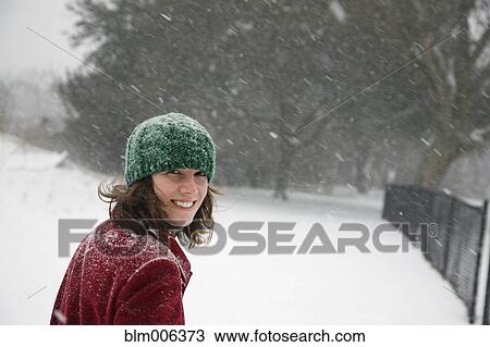 Caucasian woman walking in snow storm View Large Photo Image Stock Image - Caucasian woman walking in snow storm. Fotosearch