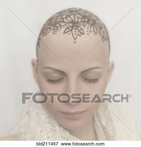 Stock Photo - Caucasian woman with bald tattooed head. Fotosearch