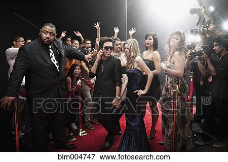Stock Photo - Celebrities arriving on red carpet. Fotosearch